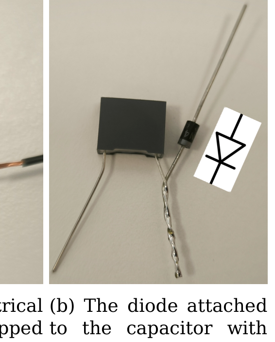 Photograph of a black capacitor with a diode soldered to one leg; the circuit symbol of the diode is drawn beside it showing the correct orientation.