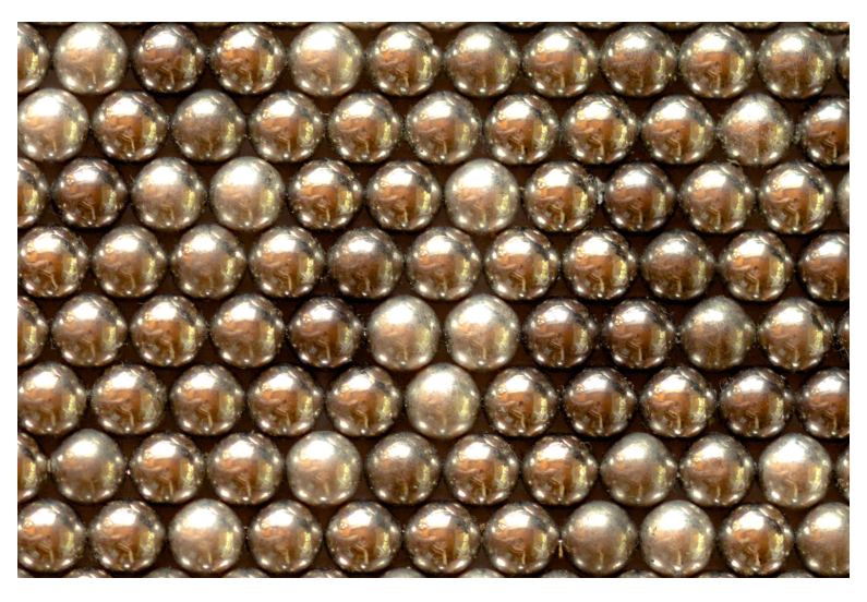 Photograph of a stable equilibrium configuration of spherical magnets in a triangular/hexagonal lattice (each magnet has six nearest neighbours).