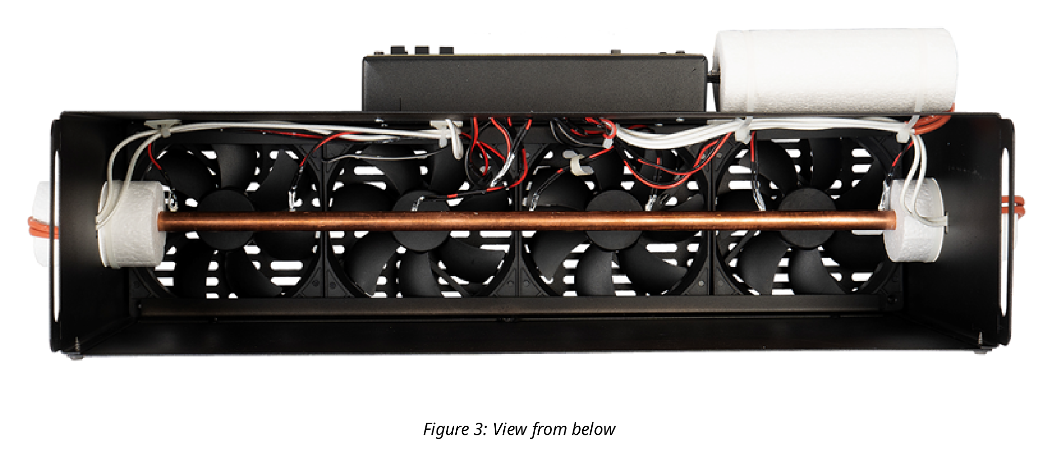 Photo taken from below the metal box showing four fans and the copper rod running horizontally across them.
